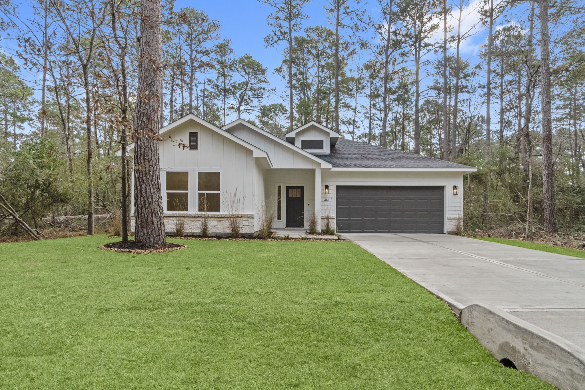 241 Clear Springs Trinity, TX 75862 - Photo 34 of 46 a front view of a house with a garden