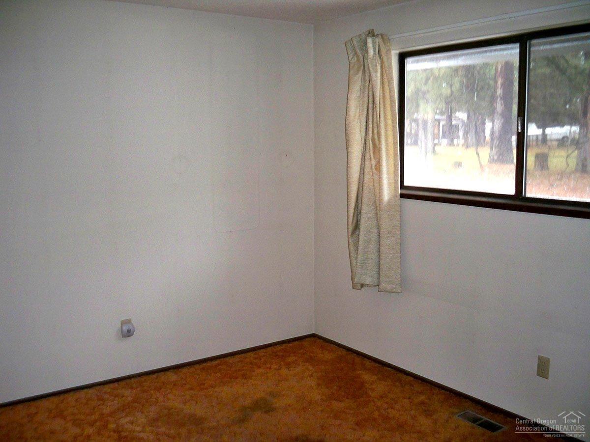 61450 Southwest Blakely Road Bend, OR 97702 - Photo 9 of 14 a view of an empty room with a window