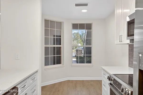 a view of kitchen with windows