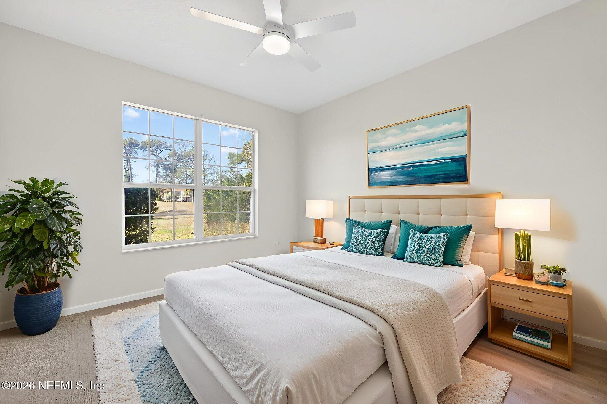 1610 Prestwick Place St. Augustine, FL 32086 - Photo 23 of 41 a bedroom with a large bed and a potted plant