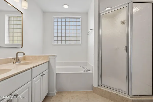 a bathroom with a bathtub and a sink