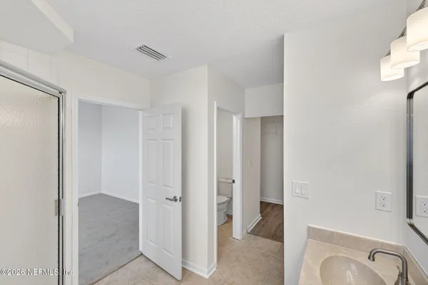 a view of a bathroom with shower
