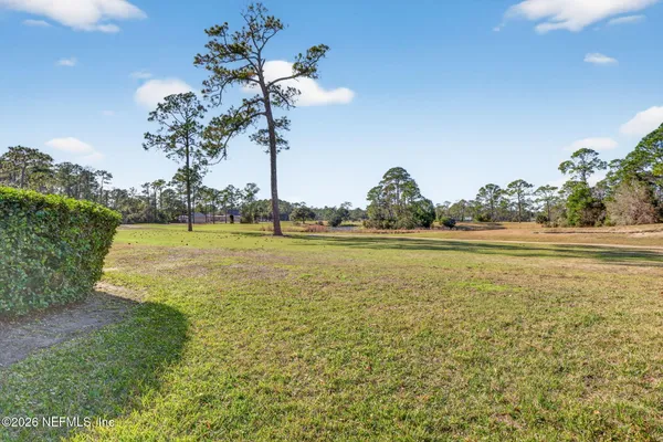 a view of a lake with a big yard