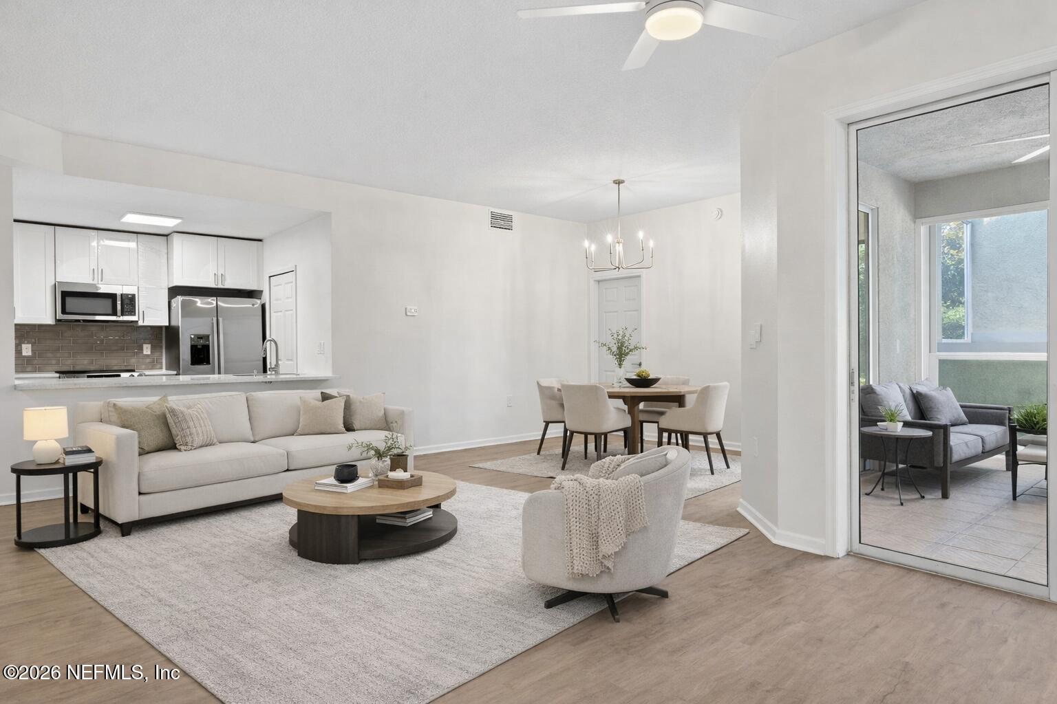 1610 Prestwick Place St. Augustine, FL 32086 - Photo 7 of 41 a living room with furniture and white walls