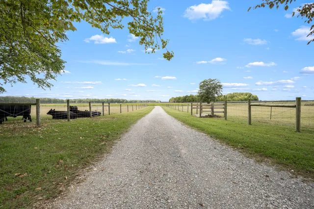 a kitchen with stainless steel appliances a refrigerator sink and cabinets
