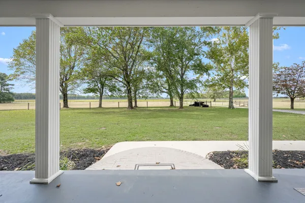 a view of kitchen with furniture and wooden floor
