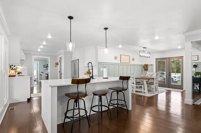 a view of a dining room with furniture and wooden floor