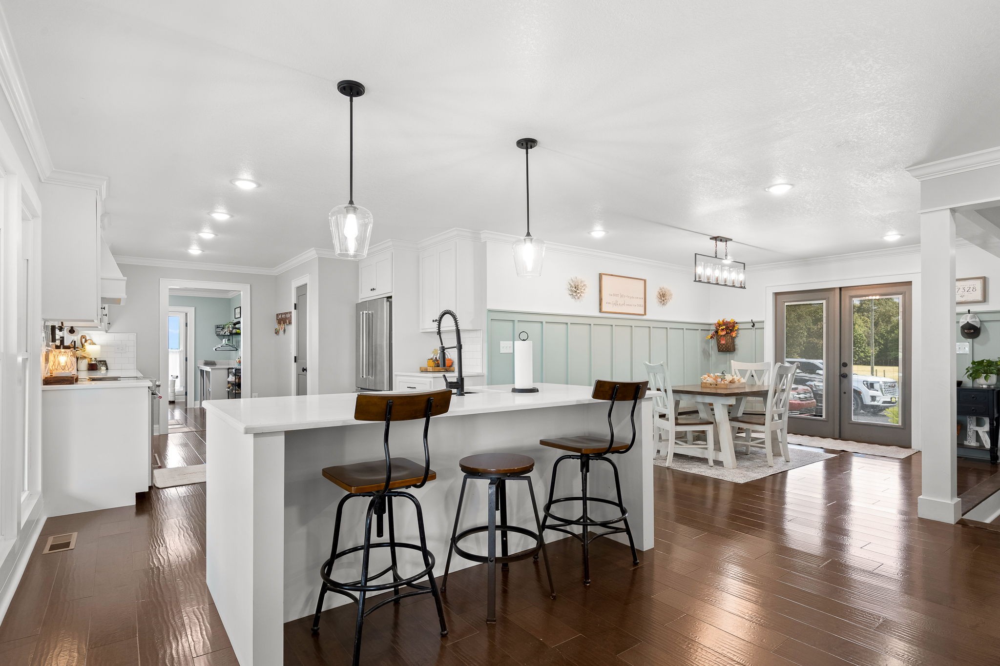 176 Terry Dunavan Road Elora, TN 37328 - Photo 28 of 85 a view of a dining room and livingroom with furniture wooden floor a chandelier
