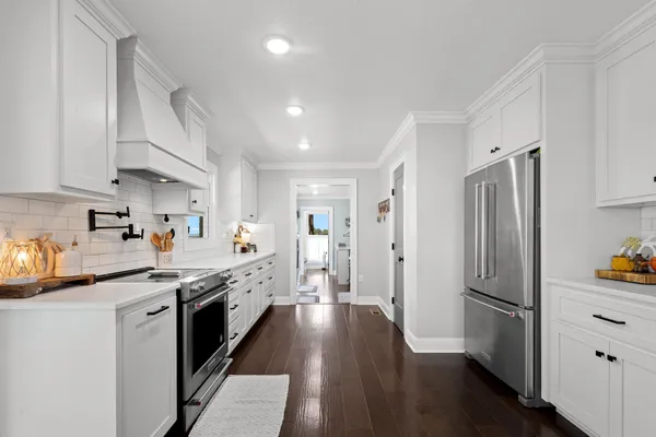 a view of a room with wooden floor and air conditioner