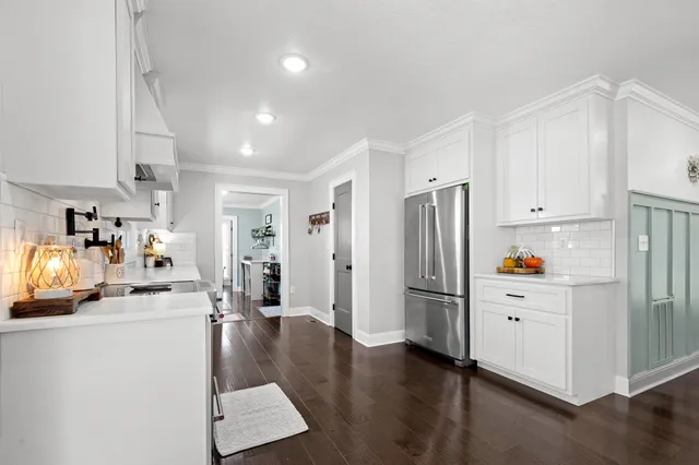a view of a room with wooden floor and air conditioner