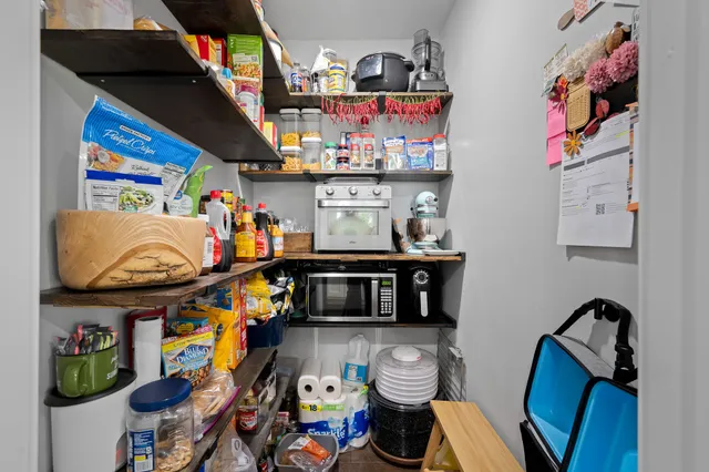 a bathroom with a double vanity sink and a window