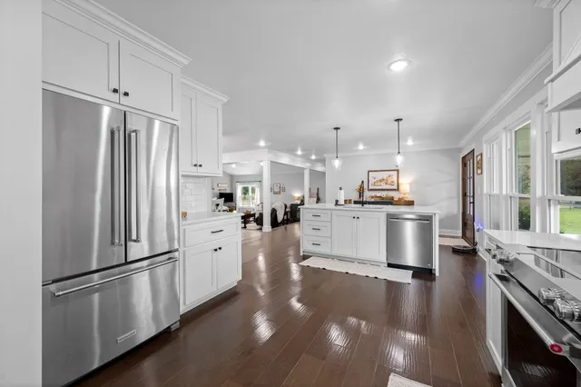 a very nice looking dining room with a table and chairs