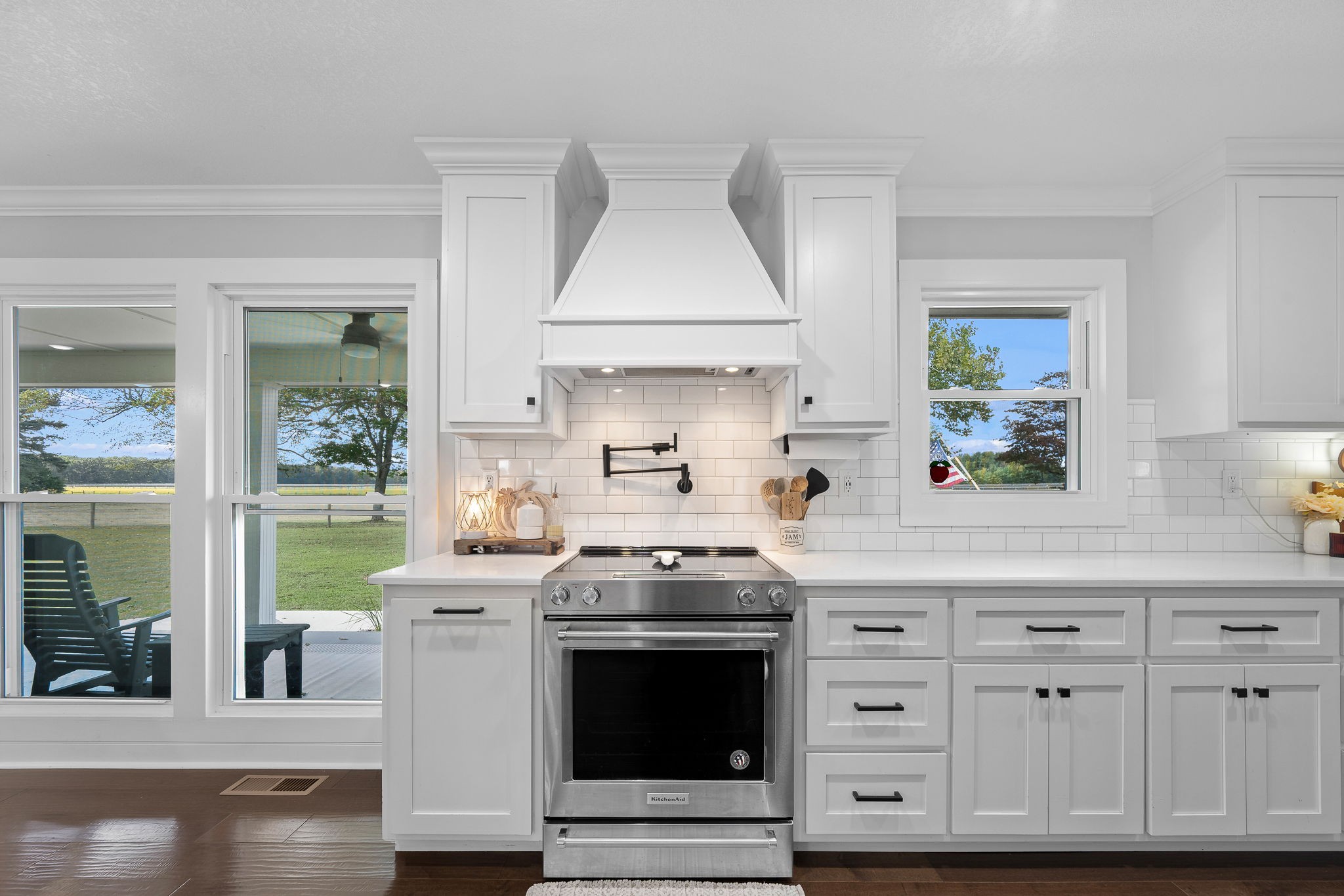 176 Terry Dunavan Road Elora, TN 37328 - Photo 38 of 85 a kitchen with stainless steel appliances granite countertop a stove and a white cabinets