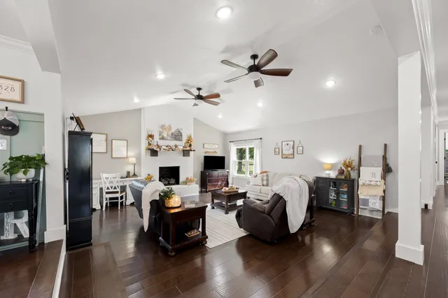 a bedroom with a bed a large window and chair