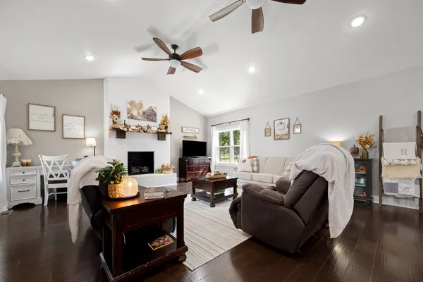 a view of a house with a yard and sitting area