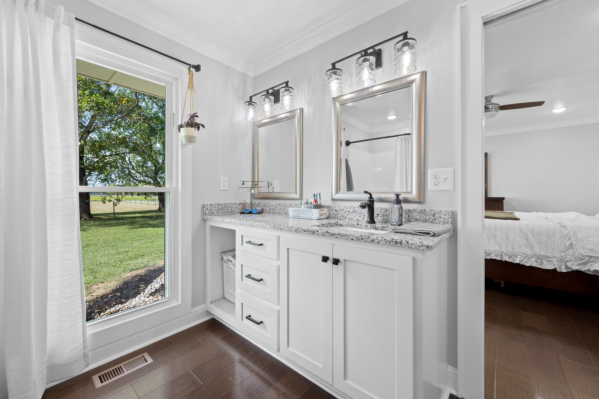 176 Terry Dunavan Road Elora, TN 37328 - Photo 56 of 85 a bathroom with a double vanity sink and a window