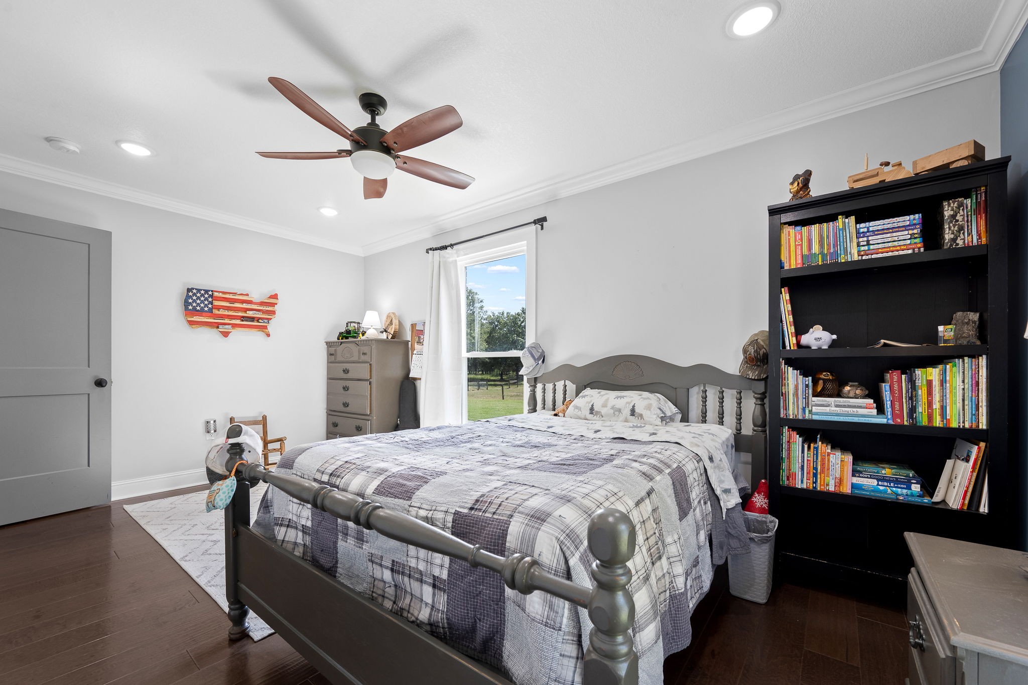 176 Terry Dunavan Road Elora, TN 37328 - Photo 61 of 85 a bed sitting in a bedroom next to a book shelf