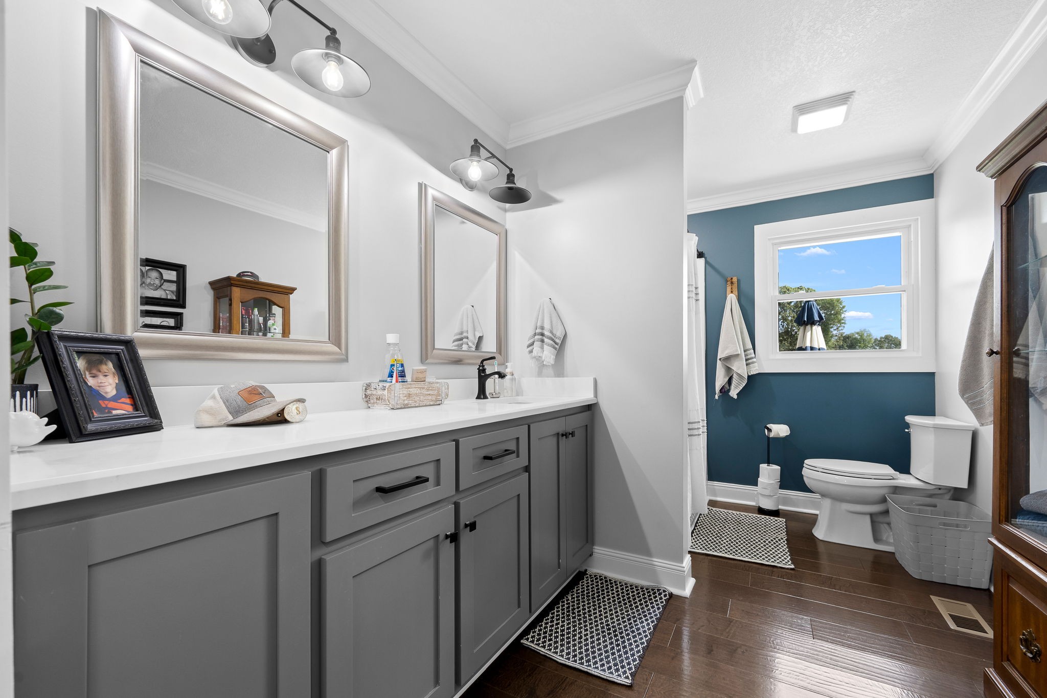 176 Terry Dunavan Road Elora, TN 37328 - Photo 63 of 85 a bathroom with a toilet a sink a mirror a vanity and view of living room