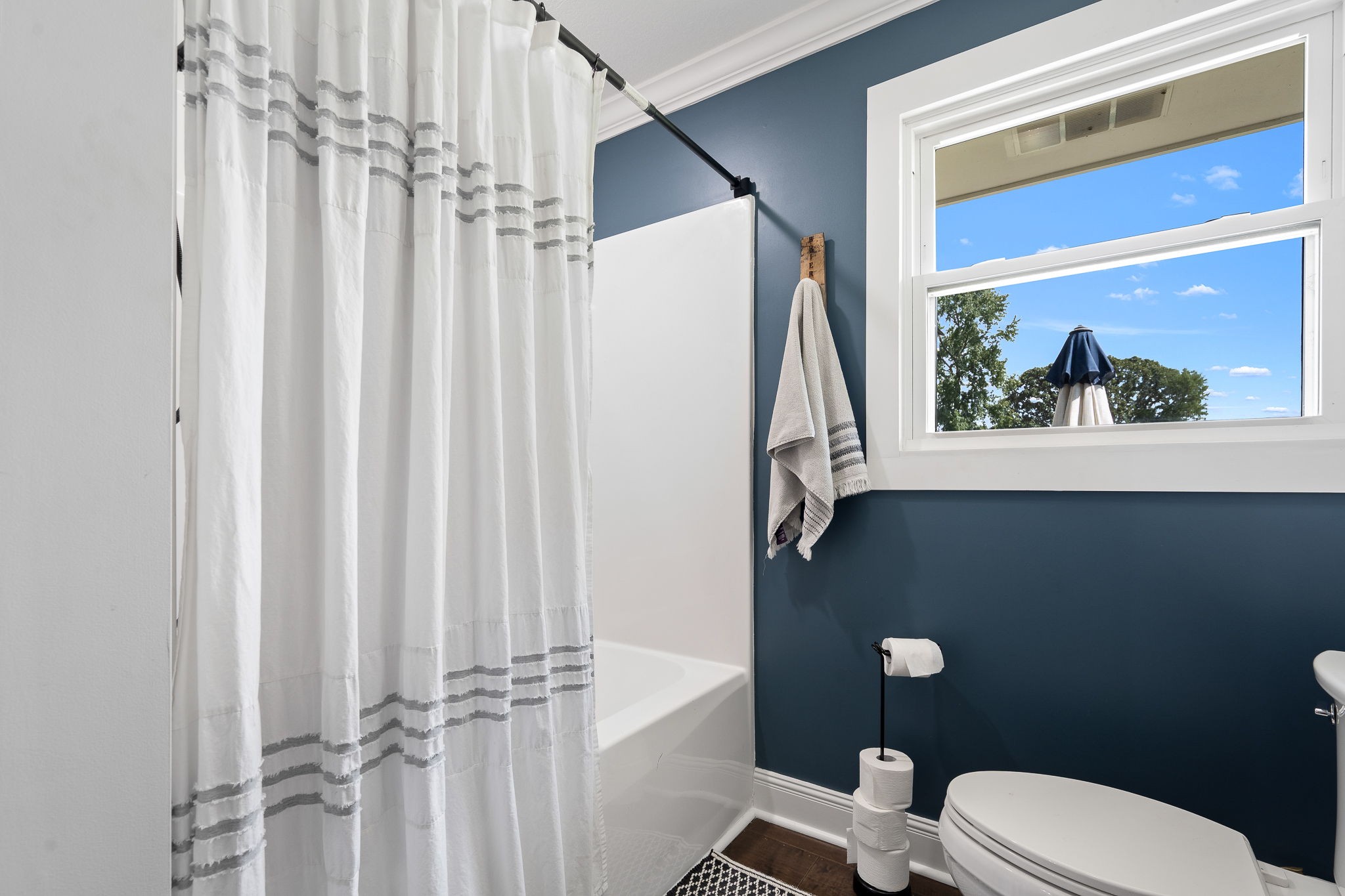 176 Terry Dunavan Road Elora, TN 37328 - Photo 65 of 85 a white toilet sitting next to a shower curtain