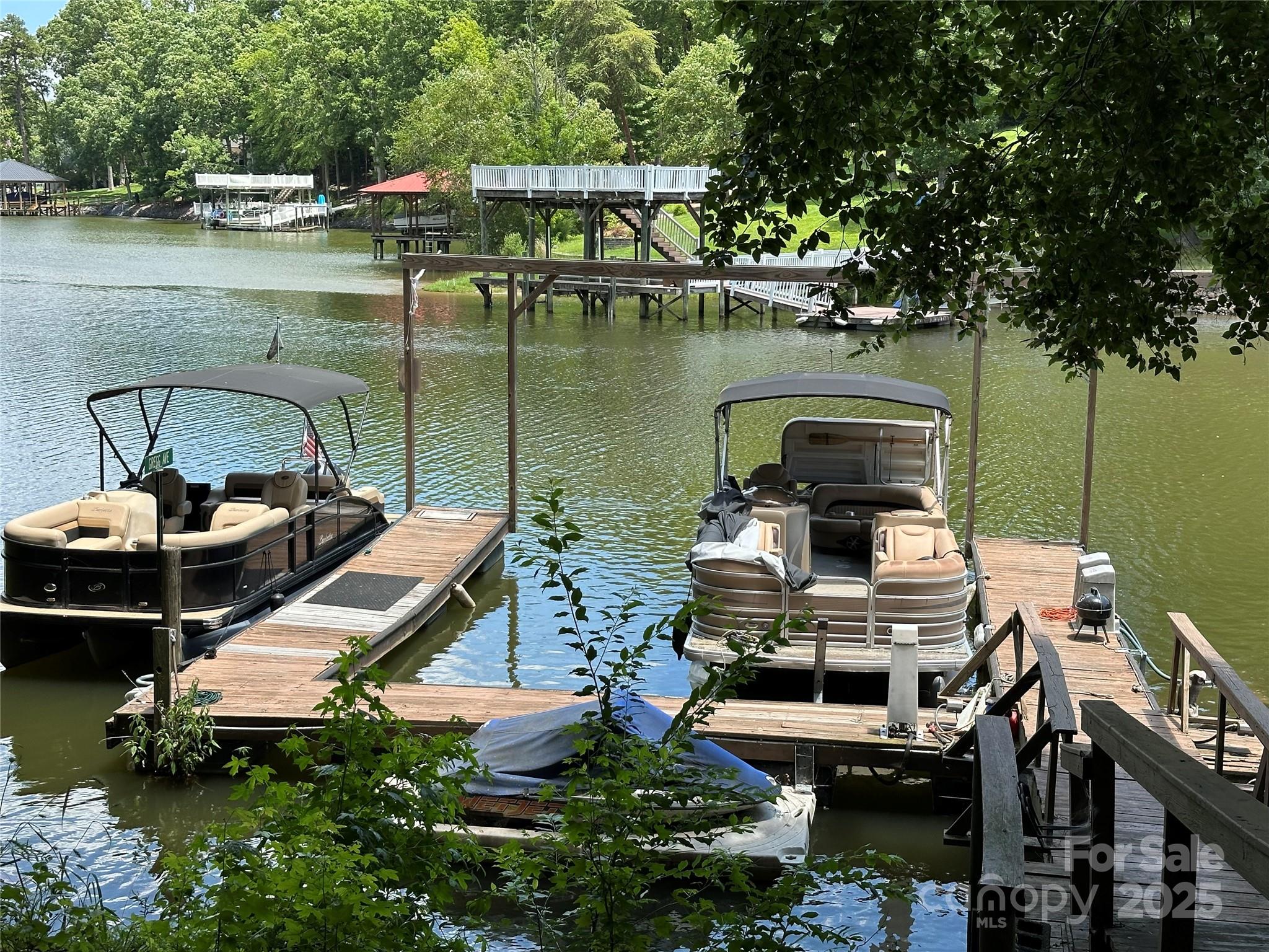 1590 Springpoint Road, Unit B Rock Hill, SC 29732 - Photo 2 of 39 a view of a lake with a car parked