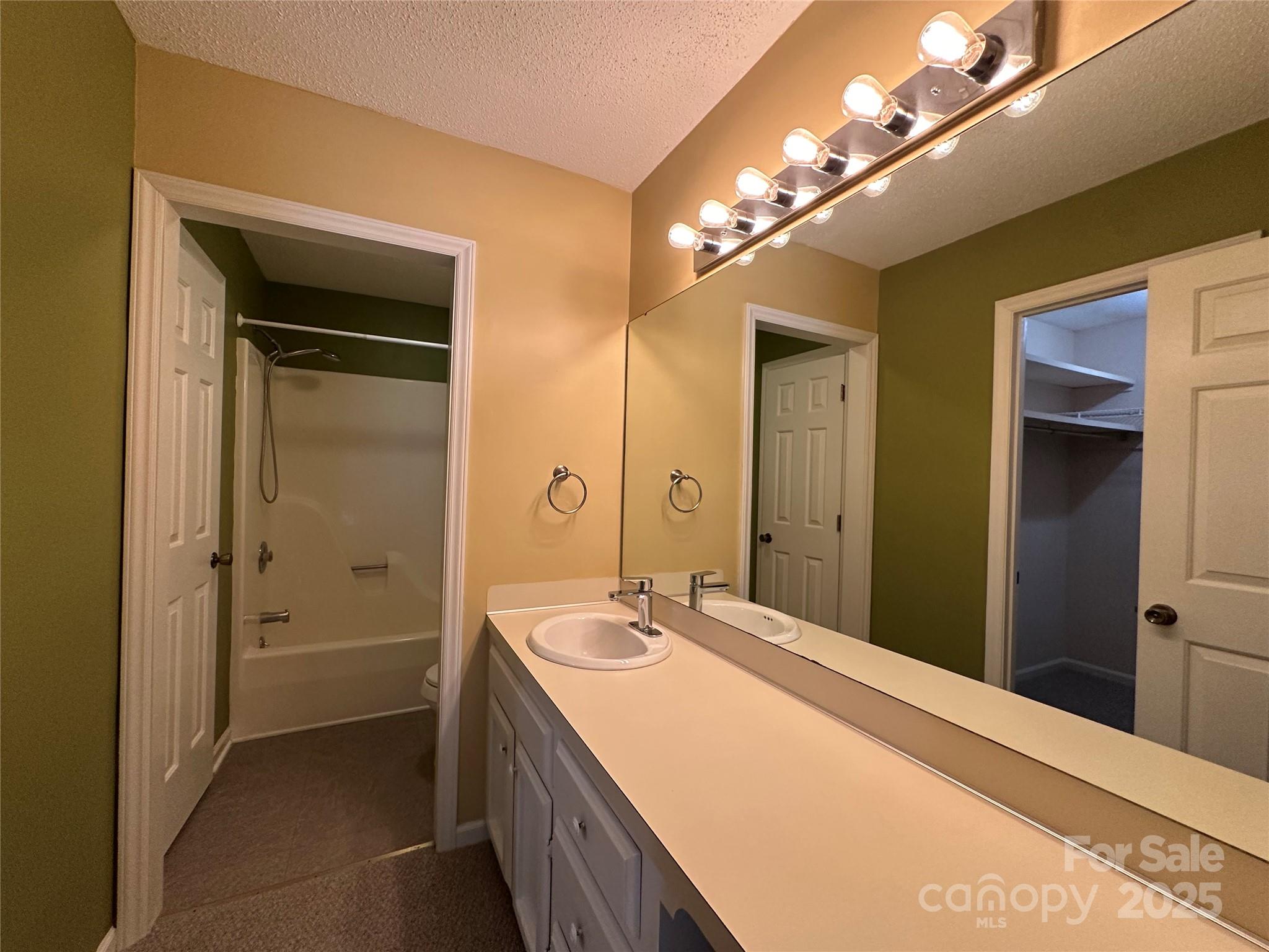 1590 Springpoint Road, Unit B Rock Hill, SC 29732 - Photo 28 of 39 a bathroom with a sink a vanity and a mirror