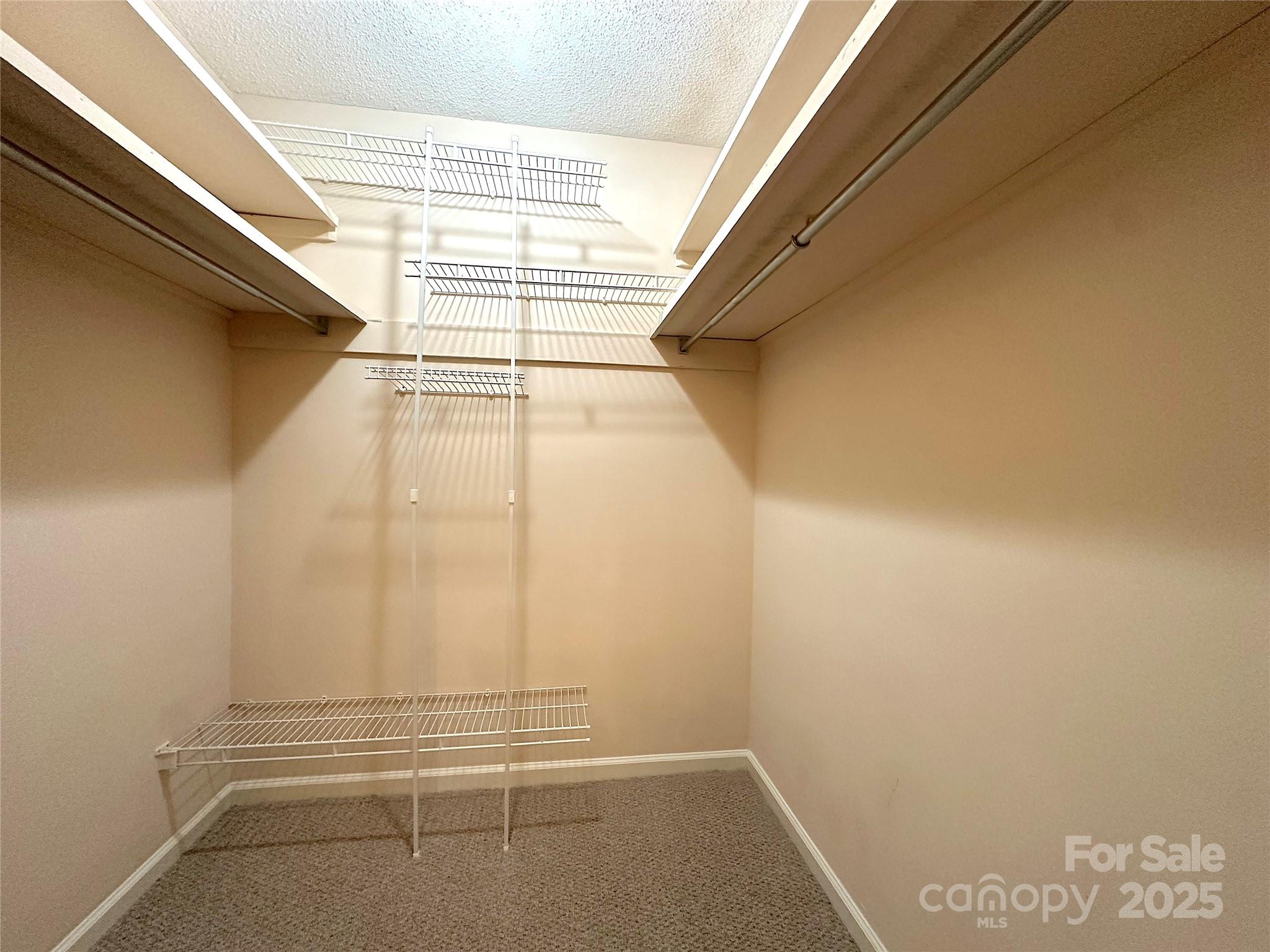 1590 Springpoint Road, Unit B Rock Hill, SC 29732 - Photo 29 of 39 a view of walk in closet with empty racks