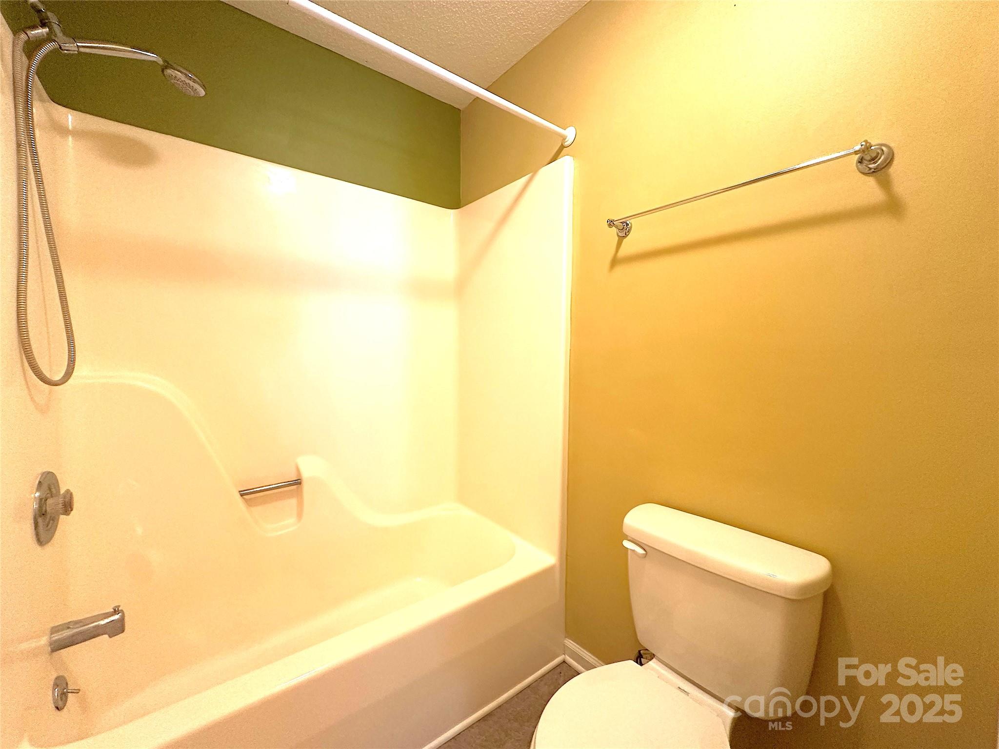 1590 Springpoint Road, Unit B Rock Hill, SC 29732 - Photo 30 of 39 a white toilet sitting next to a bathroom sink and a shower