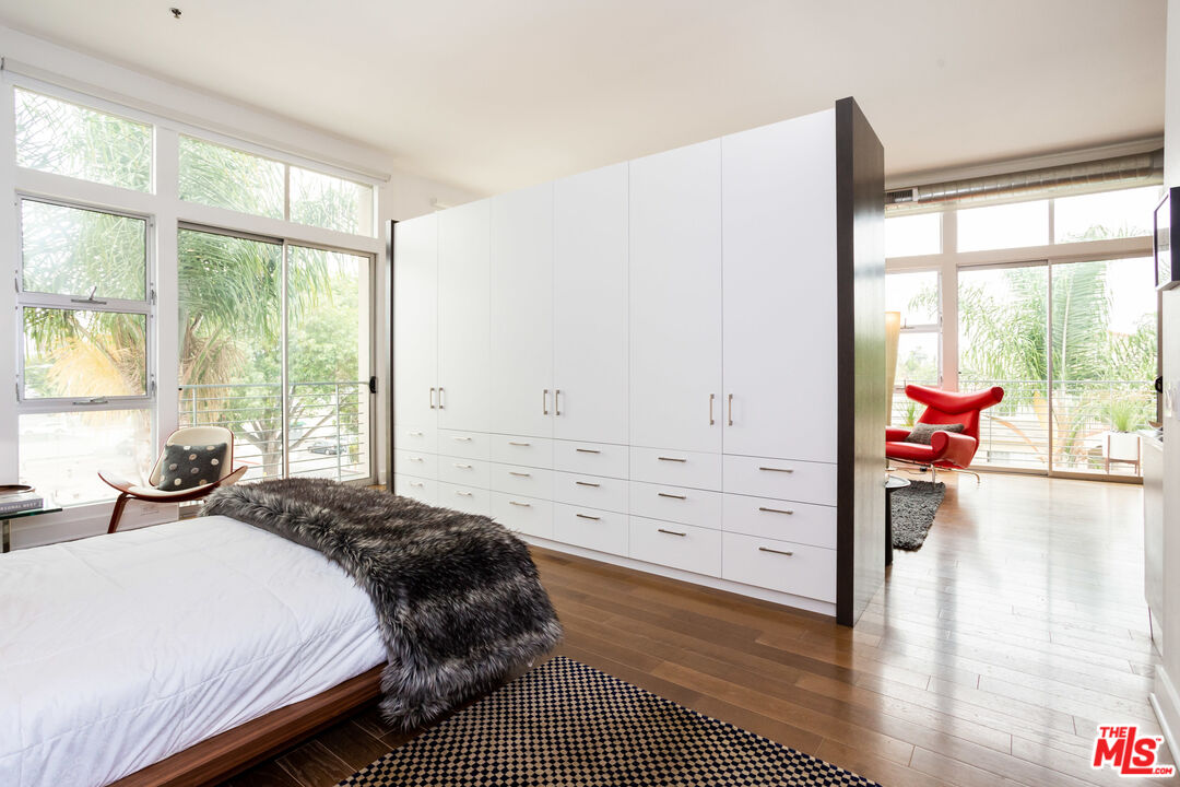 13320 Beach Avenue, Unit 304 Marina del Rey, CA 90292 - Photo 11 of 23 a bedroom with a bed and a large window