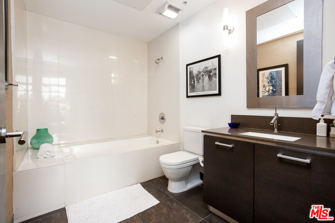 13320 Beach Avenue, Unit 304 Marina del Rey, CA 90292 - Photo 14 of 23 a bathroom with a sink toilet and shower