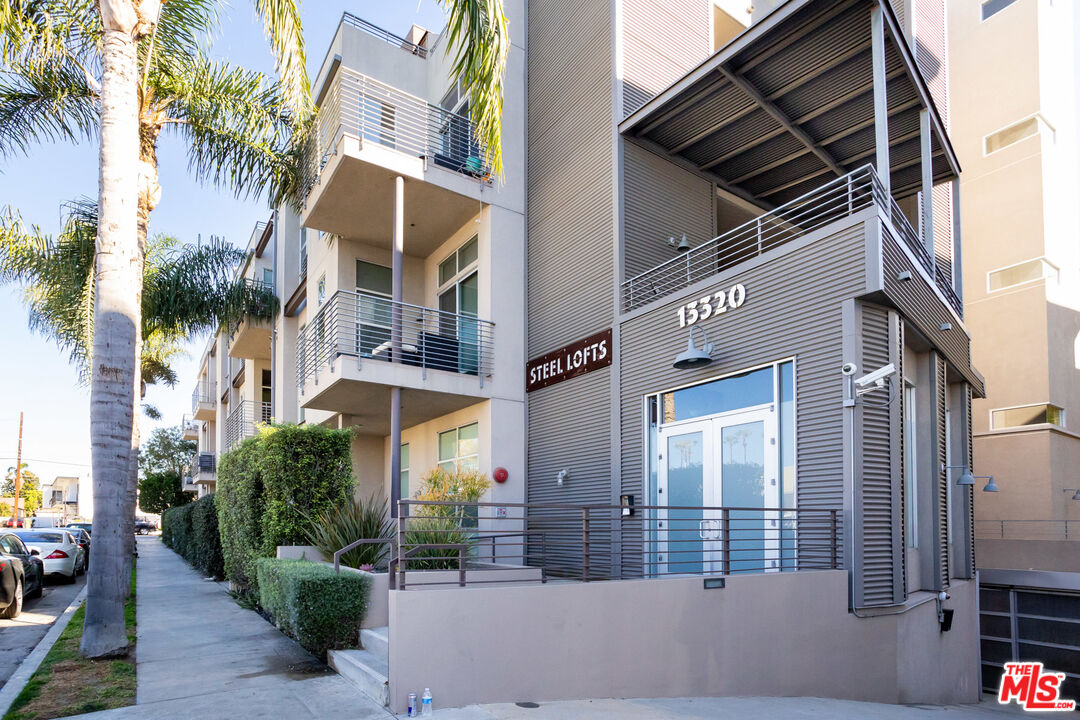 13320 Beach Avenue, Unit 304 Marina del Rey, CA 90292 - Photo 20 of 23 a view of the house with a yard