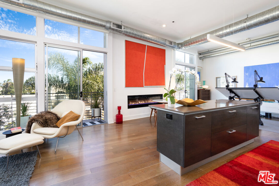 13320 Beach Avenue, Unit 304 Marina del Rey, CA 90292 - Photo 2 of 23 a living room with furniture and floor to ceiling windows