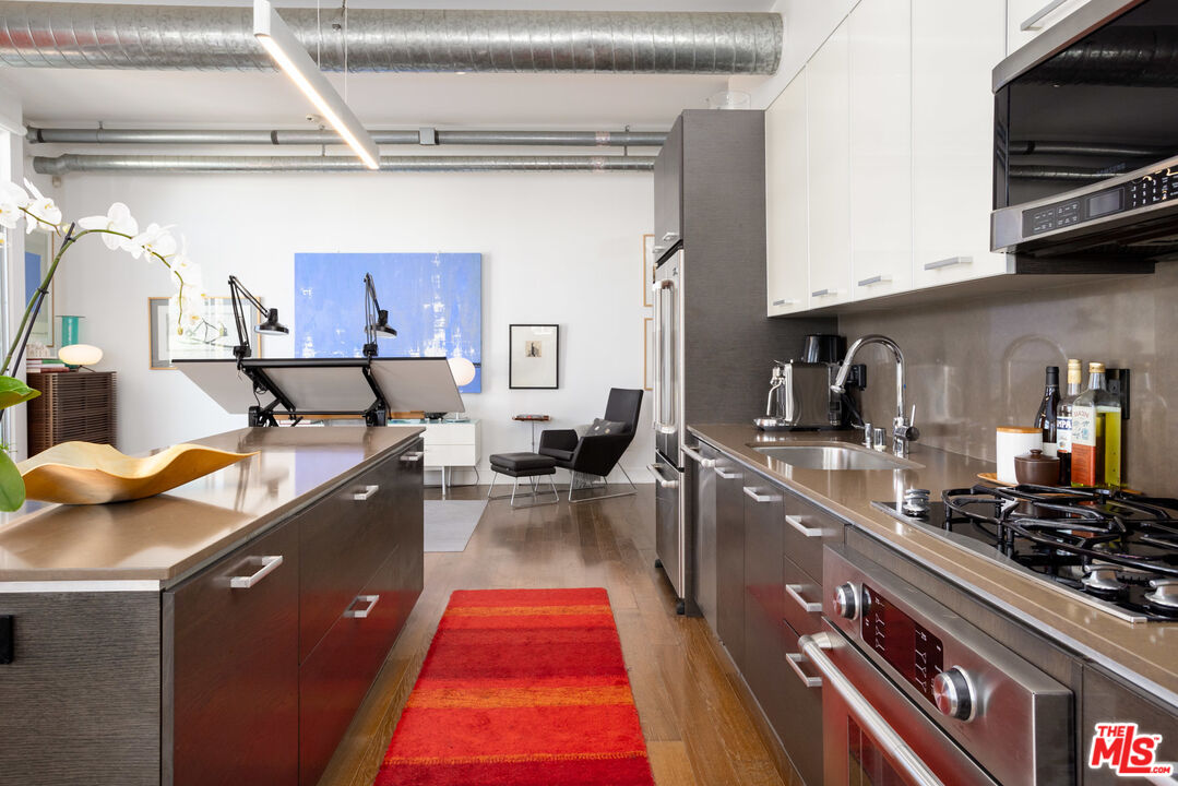 13320 Beach Avenue, Unit 304 Marina del Rey, CA 90292 - Photo 4 of 23 a kitchen with lots of appliances