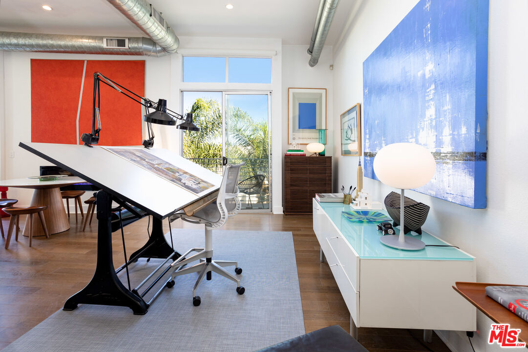 13320 Beach Avenue, Unit 304 Marina del Rey, CA 90292 - Photo 6 of 23 a view of a workspace with furniture and wooden floor