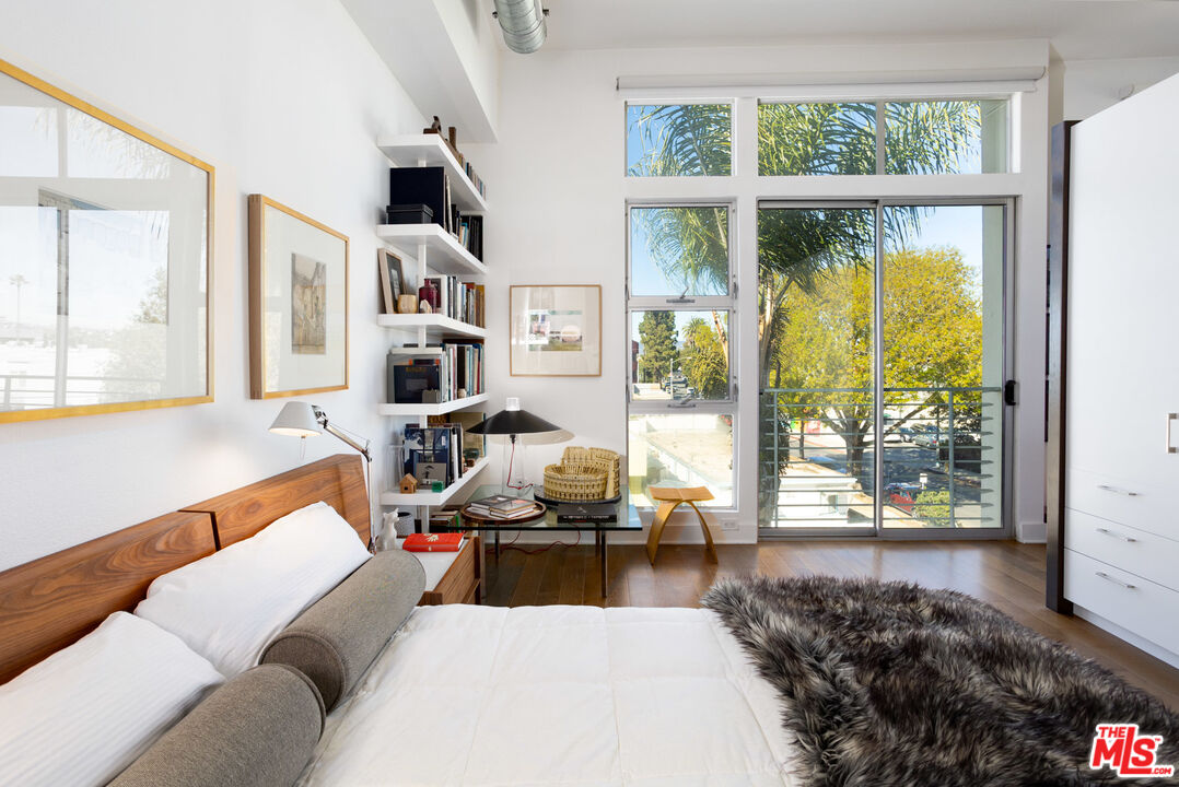 13320 Beach Avenue, Unit 304 Marina del Rey, CA 90292 - Photo 8 of 23 a living room with furniture a rug and a large window