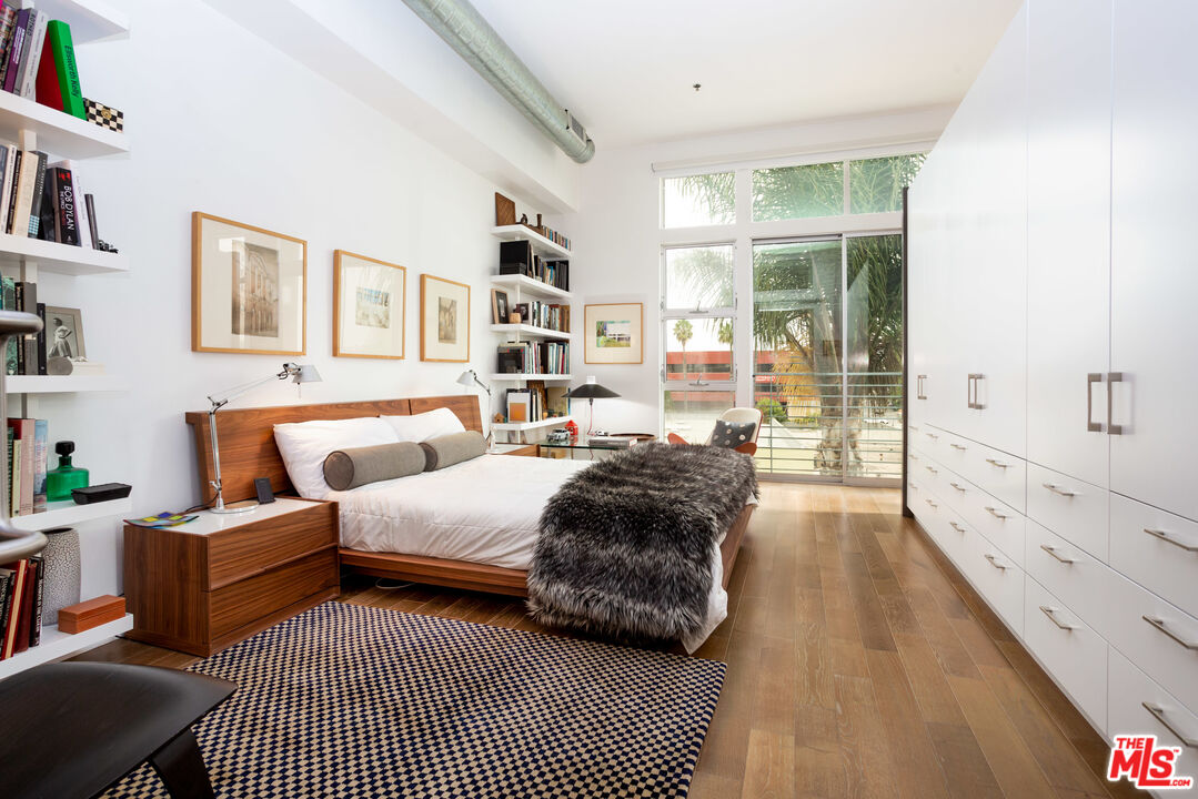 13320 Beach Avenue, Unit 304 Marina del Rey, CA 90292 - Photo 9 of 23 a large bedroom with a bed and a large window
