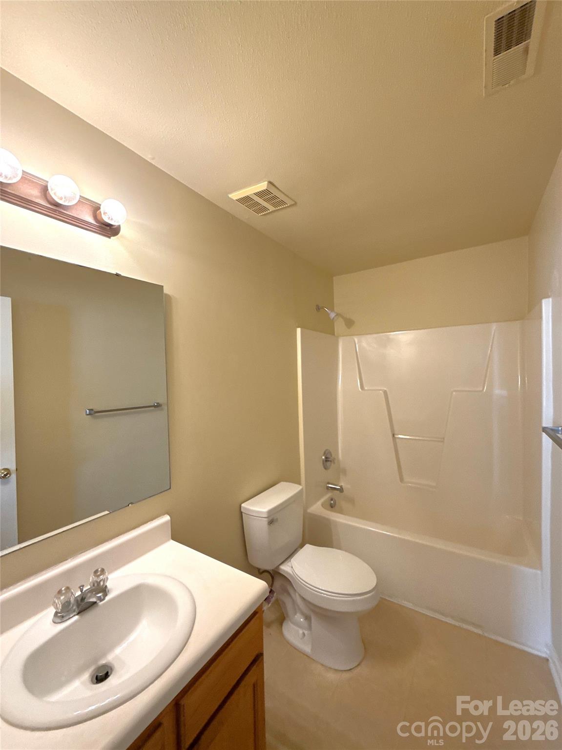 6831 Sunman Road Charlotte, NC 28216 - Photo 11 of 14 a bathroom with a sink a toilet and shower