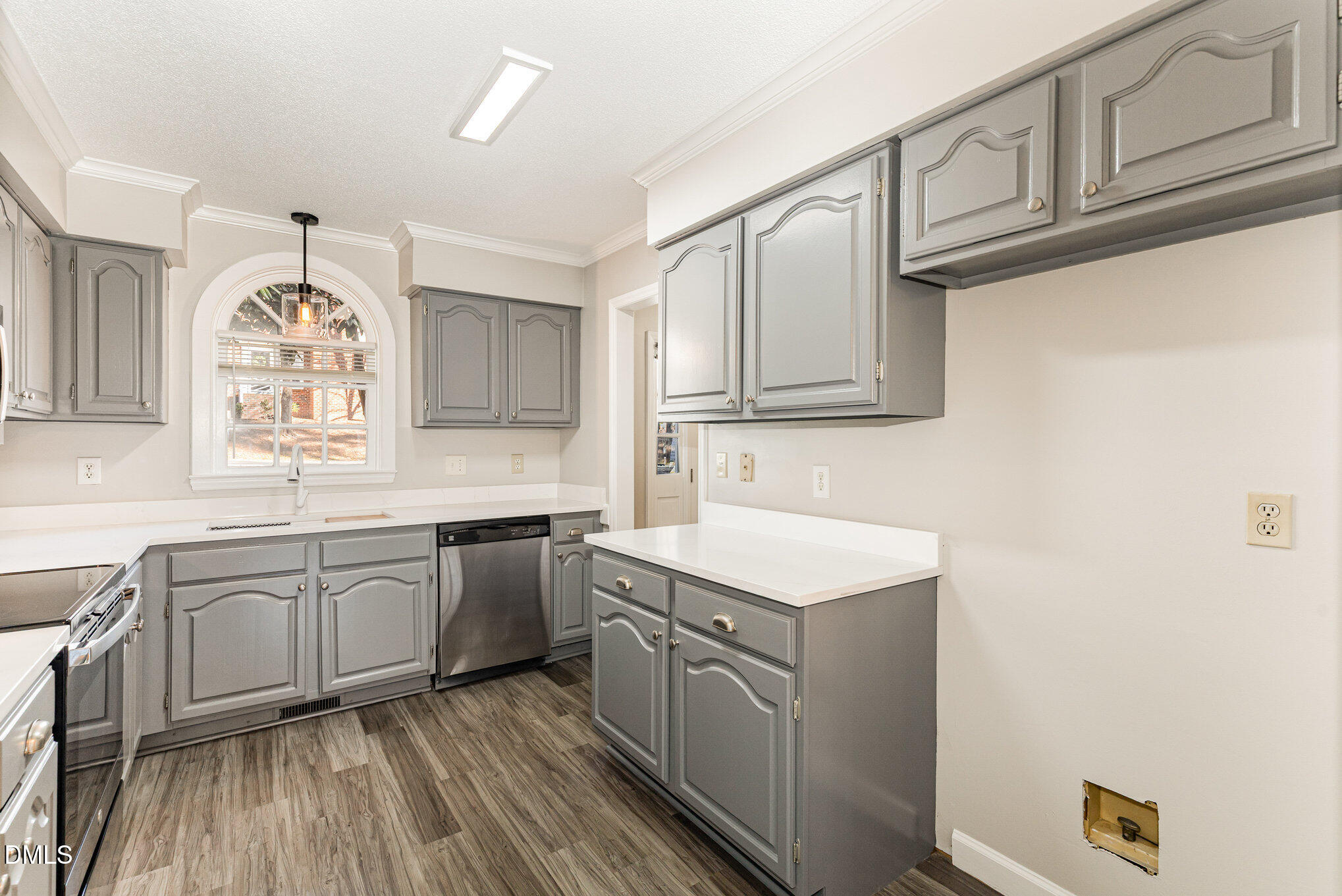 4534 Hamptonshire Drive Raleigh, NC 27613 - Photo 12 of 27 a kitchen with granite countertop white cabinets and white appliances