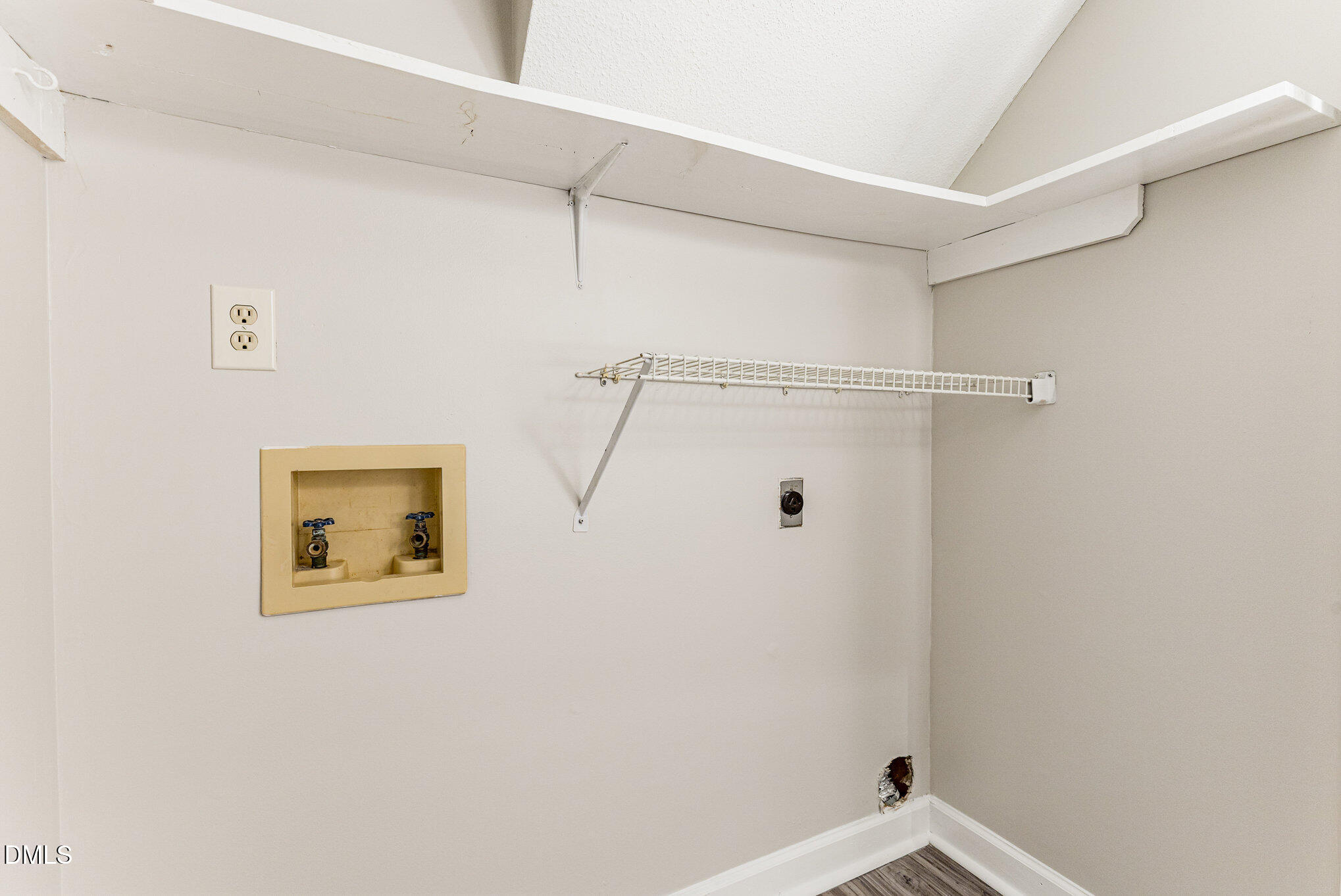 4534 Hamptonshire Drive Raleigh, NC 27613 - Photo 15 of 27 a view of a wall with rack on the wall