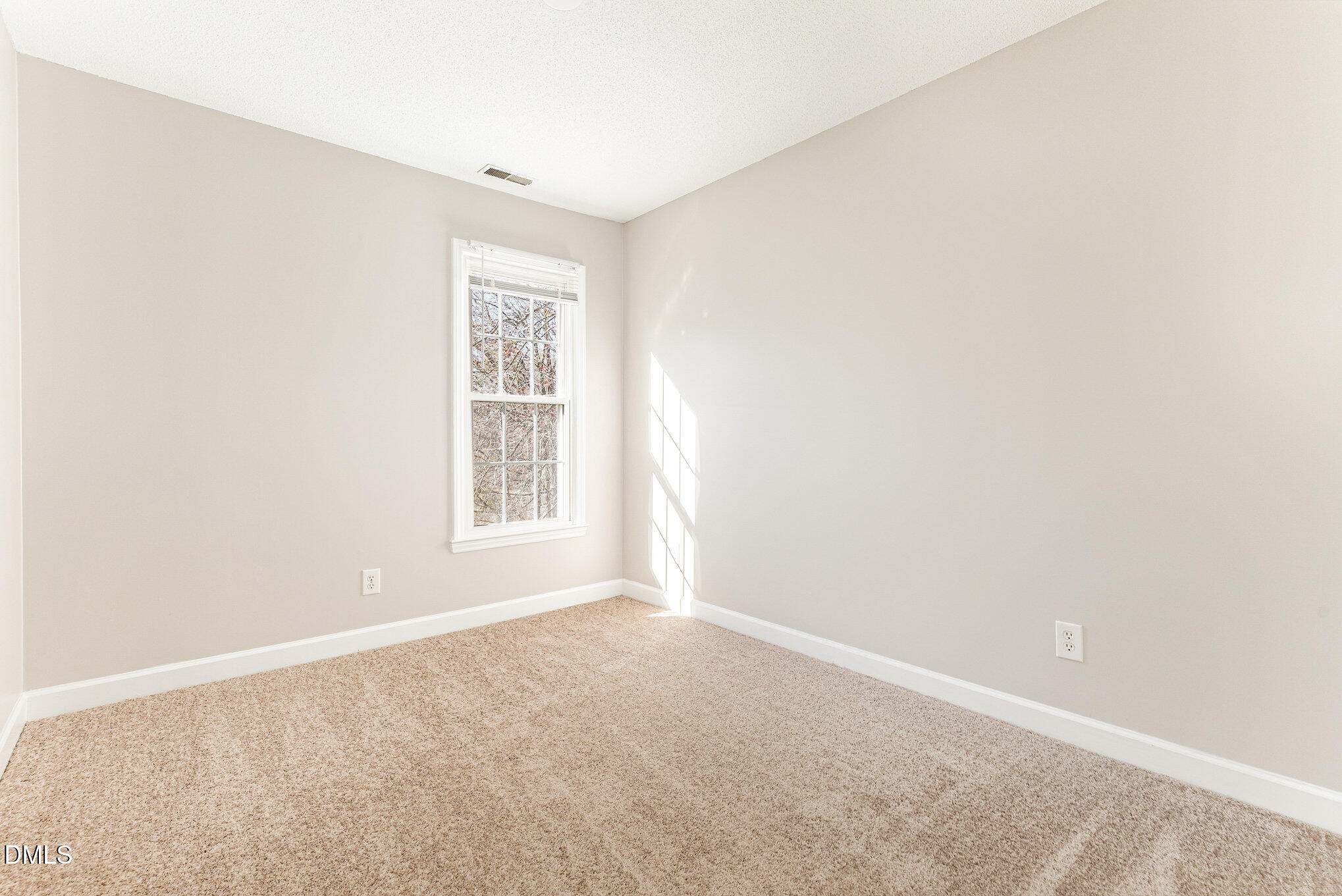 4534 Hamptonshire Drive Raleigh, NC 27613 - Photo 19 of 27 a view of an empty room with a window
