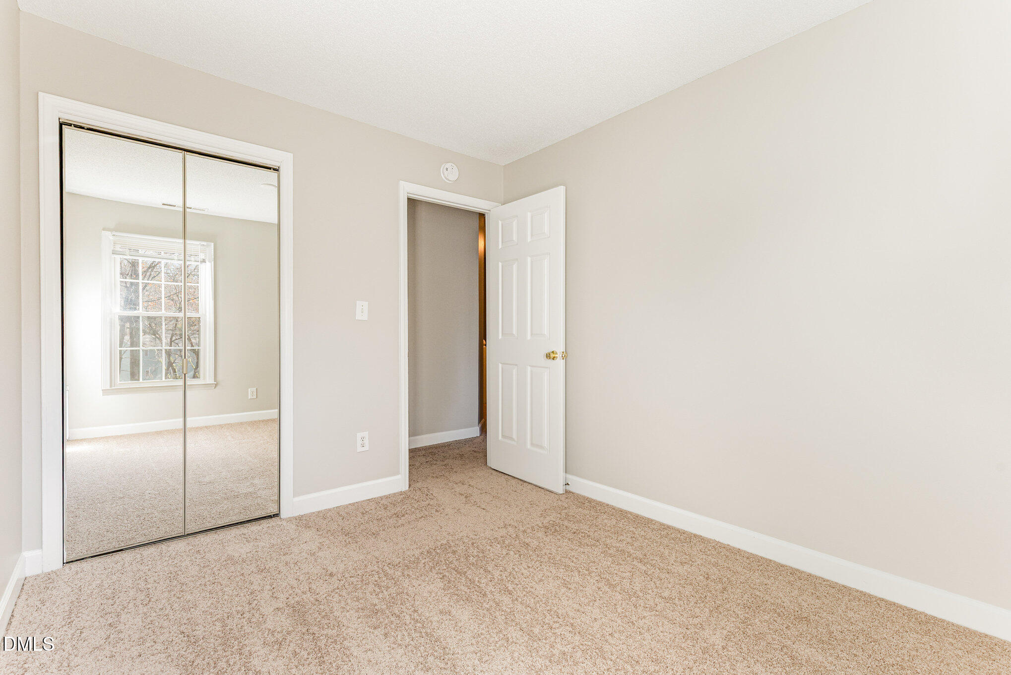 4534 Hamptonshire Drive Raleigh, NC 27613 - Photo 20 of 27 an empty room with windows