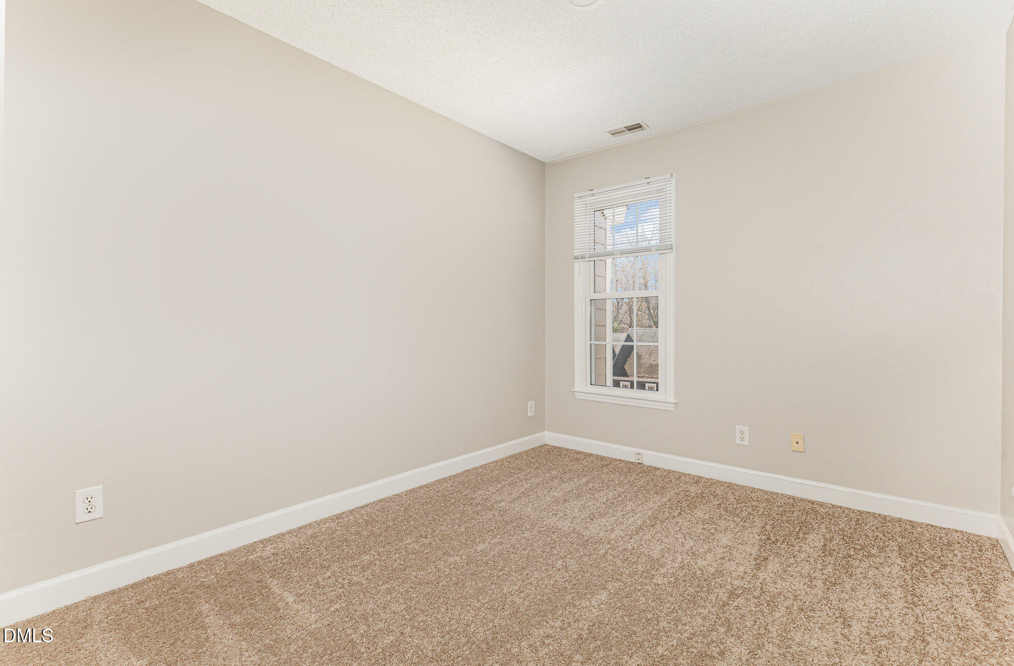 4534 Hamptonshire Drive Raleigh, NC 27613 - Photo 22 of 27 an empty room with windows