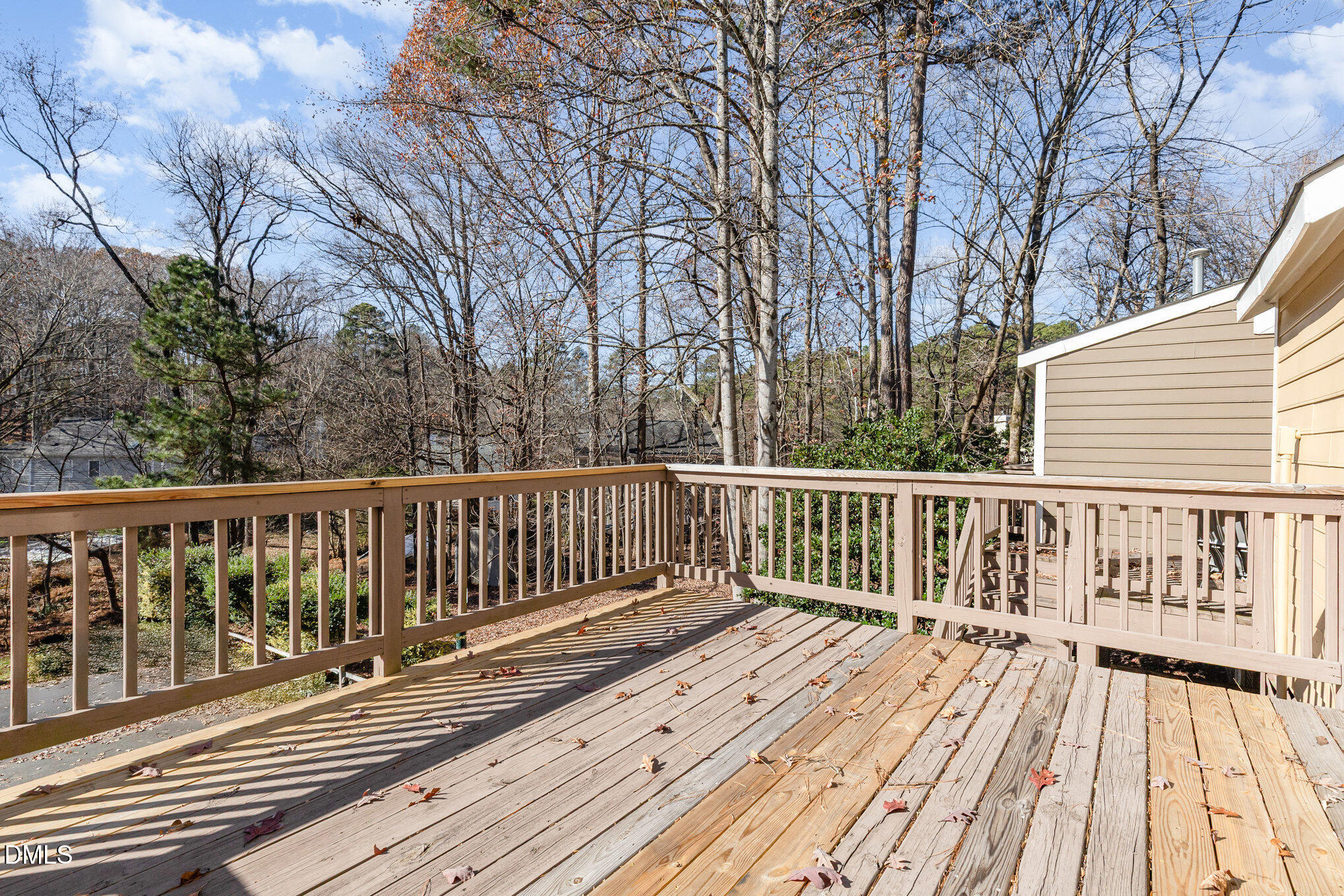 4534 Hamptonshire Drive Raleigh, NC 27613 - Photo 25 of 27 a view of balcony with wooden floor and fence