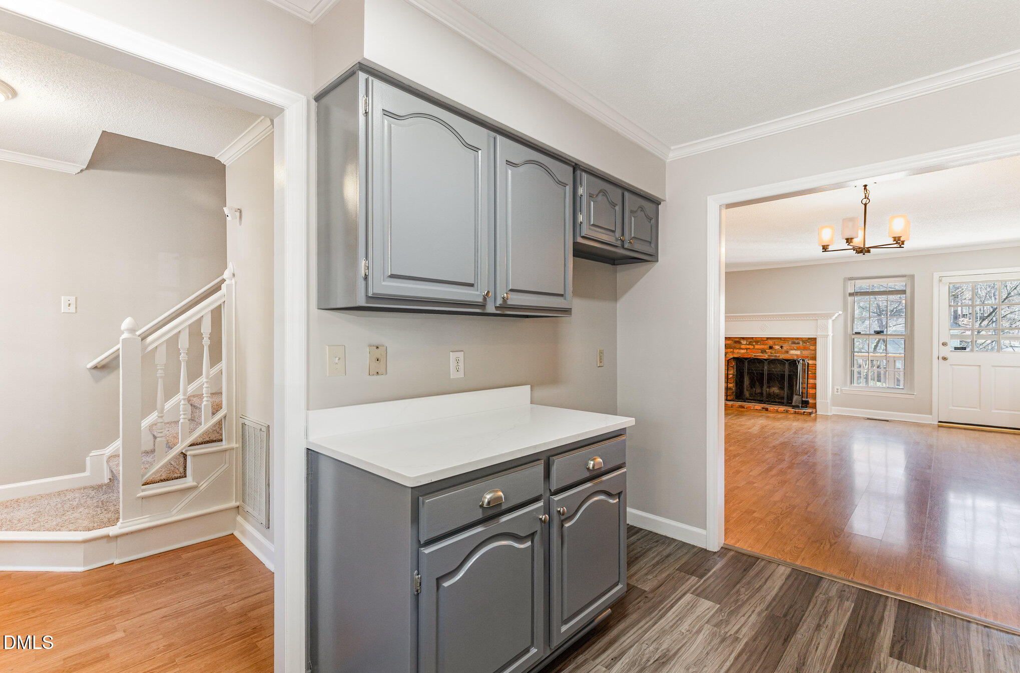 4534 Hamptonshire Drive Raleigh, NC 27613 - Photo 8 of 27 a kitchen with stainless steel appliances granite countertop a refrigerator a stove and a wooden floors