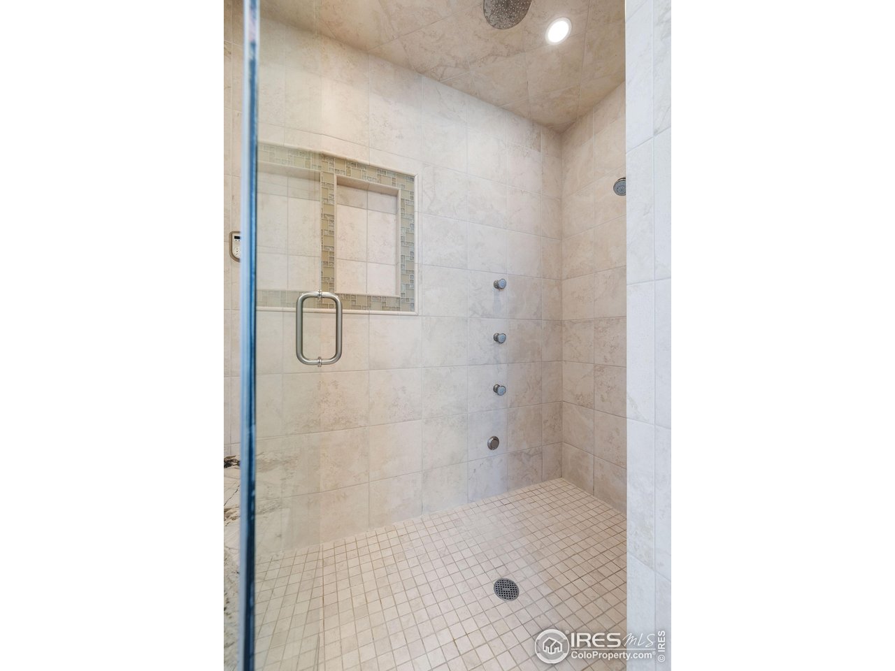 7205 Rustic Trail Boulder, CO 80301 - Photo 32 of 49 a bathroom with a glass shower door
