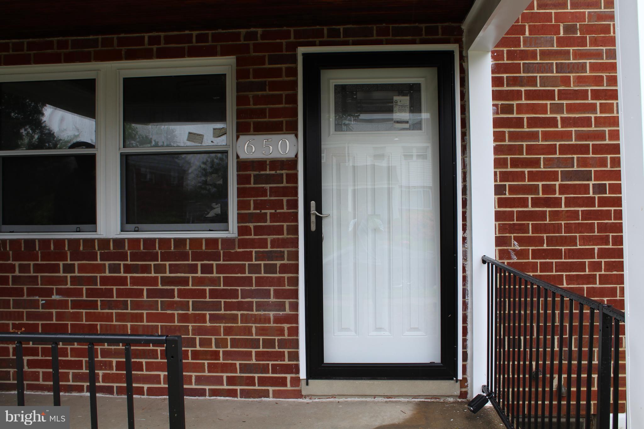 650 Queensgate Road Baltimore, MD 21229 - Photo 2 of 25 a view of front door