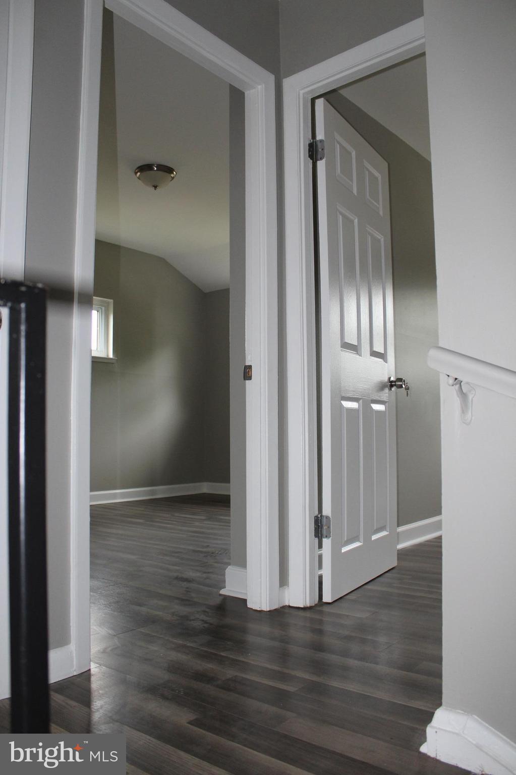 650 Queensgate Road Baltimore, MD 21229 - Photo 12 of 25 a view of empty room with wooden floor