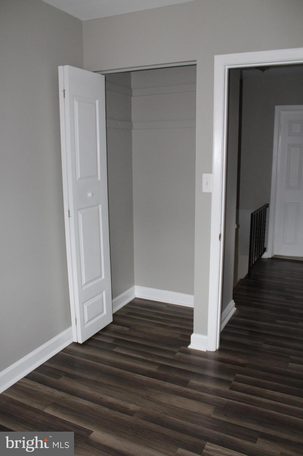 650 Queensgate Road Baltimore, MD 21229 - Photo 15 of 25 a view of a hallway with wooden floor