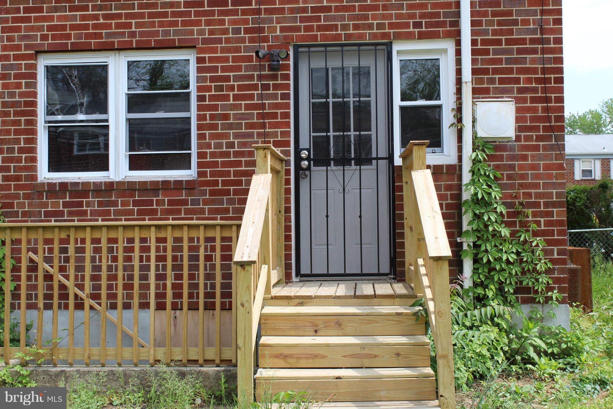 650 Queensgate Road Baltimore, MD 21229 - Photo 25 of 25 a front view of a house with a window