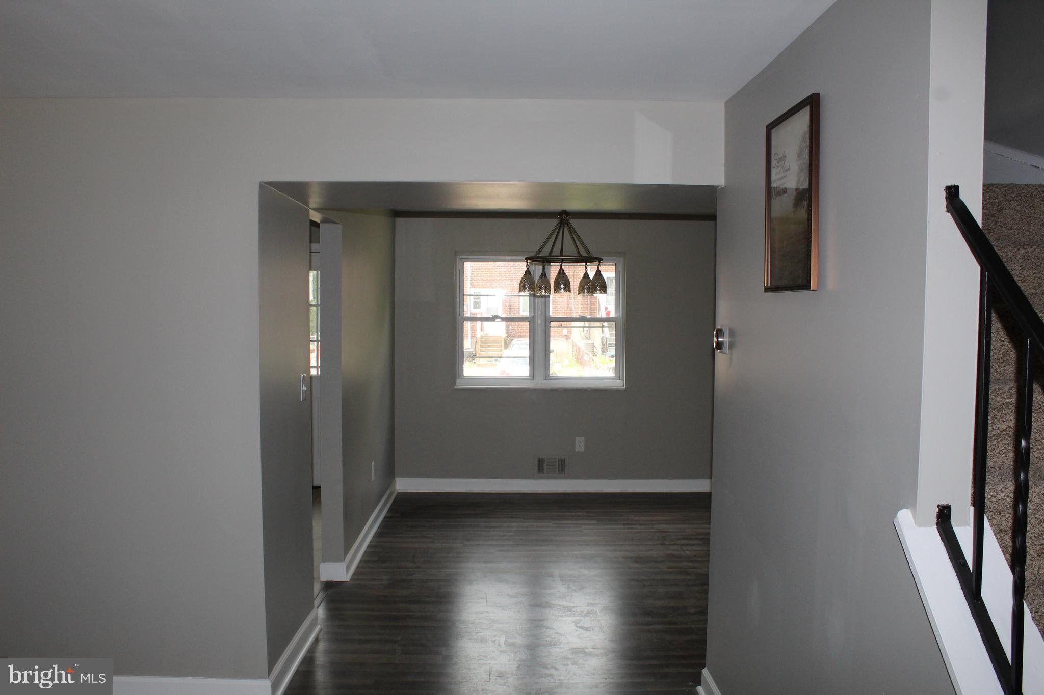 650 Queensgate Road Baltimore, MD 21229 - Photo 6 of 25 a view of entryway with wooden floor