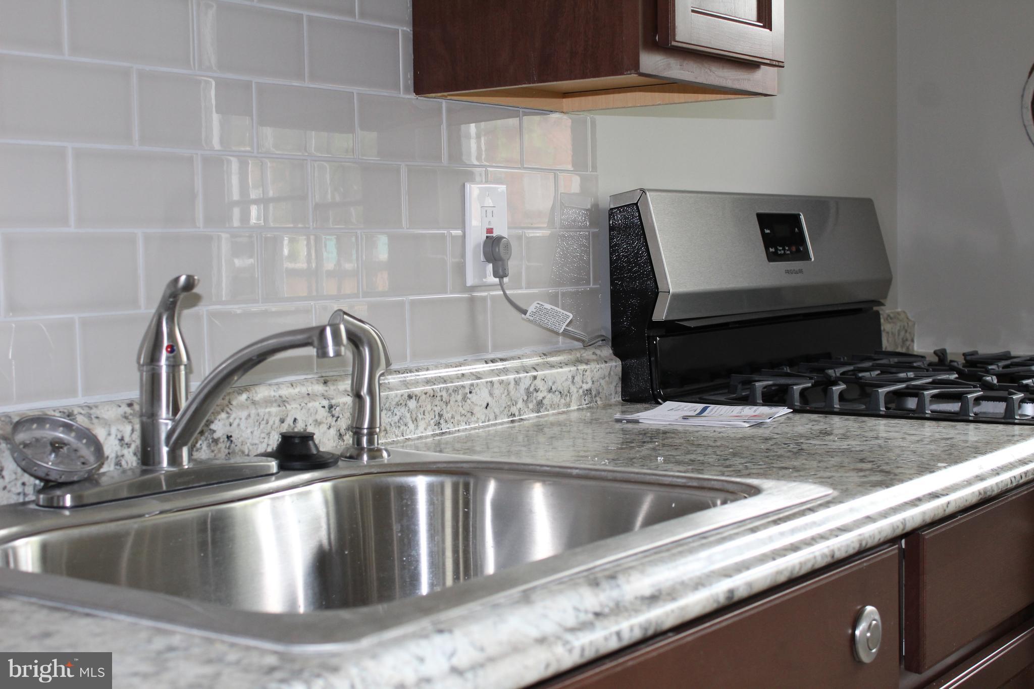 650 Queensgate Road Baltimore, MD 21229 - Photo 7 of 25 a close view of sink and tap